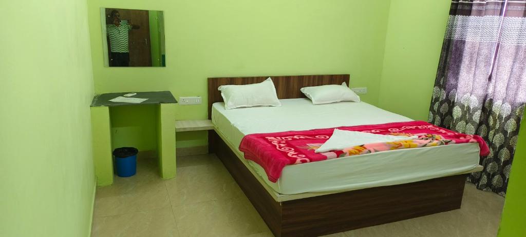 Postel nebo postele na pokoji v ubytování Hotel Siddhi