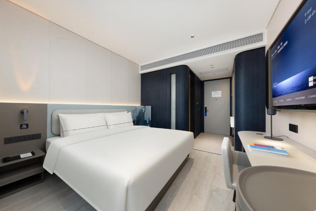TV a/nebo společenská místnost v ubytování Atour Light Hotel Guangzhou Taikoo Hui Grand Plaza