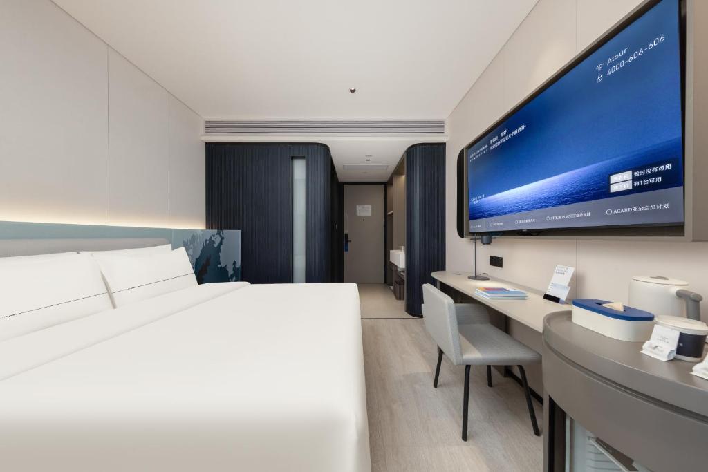 TV a/nebo společenská místnost v ubytování Atour Light Hotel Guangzhou Taikoo Hui Grand Plaza