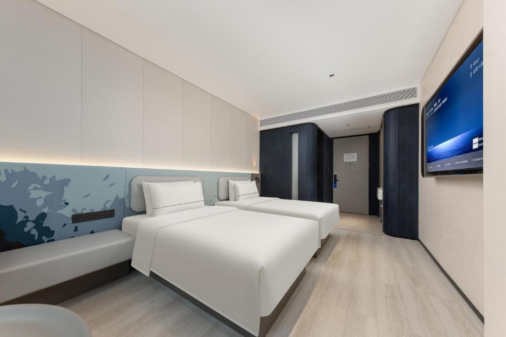 Postel nebo postele na pokoji v ubytování Atour Light Hotel Guangzhou Taikoo Hui Grand Plaza
