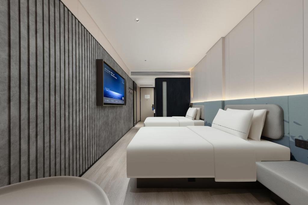Postel nebo postele na pokoji v ubytování Atour Light Hotel Guangzhou Taikoo Hui Grand Plaza