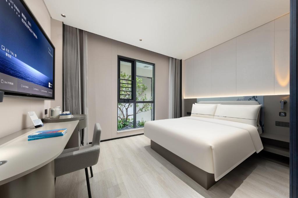 Postel nebo postele na pokoji v ubytování Atour Light Hotel Guangzhou Taikoo Hui Grand Plaza