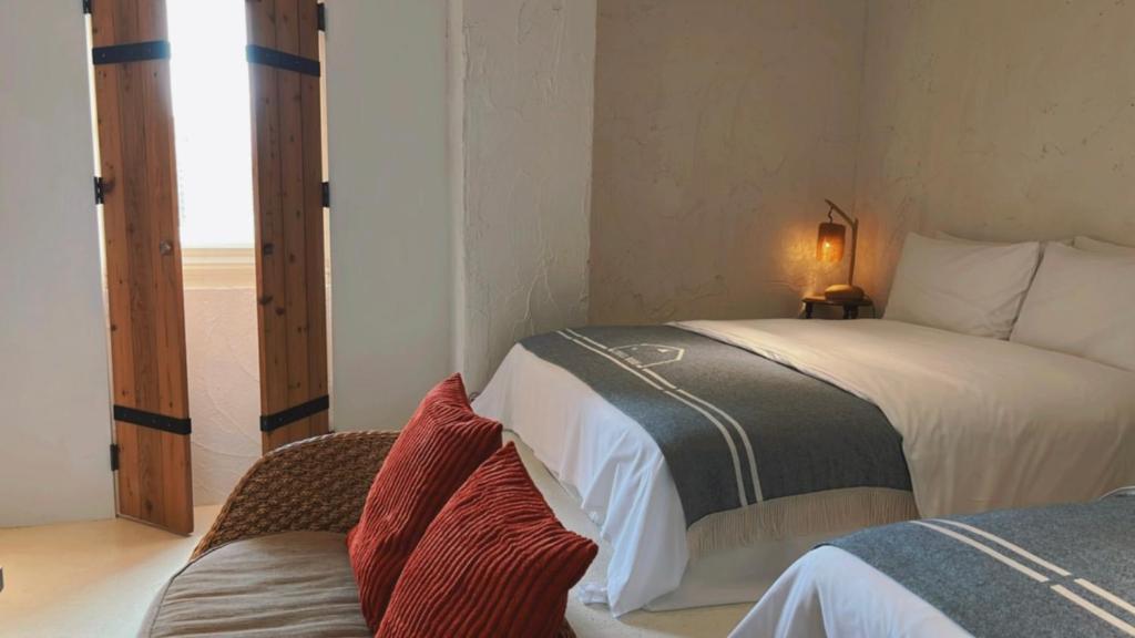 Postel nebo postele na pokoji v ubytování Chill Roof Hotel