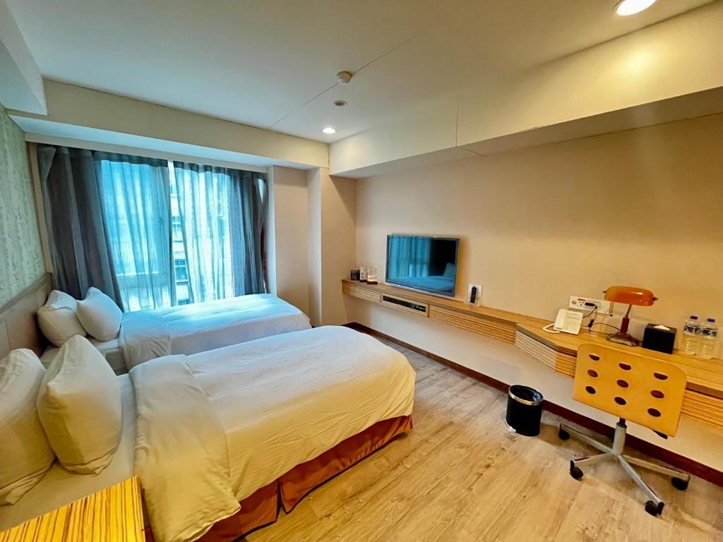 TV a/nebo společenská místnost v ubytování NAGAHIRO Hotel