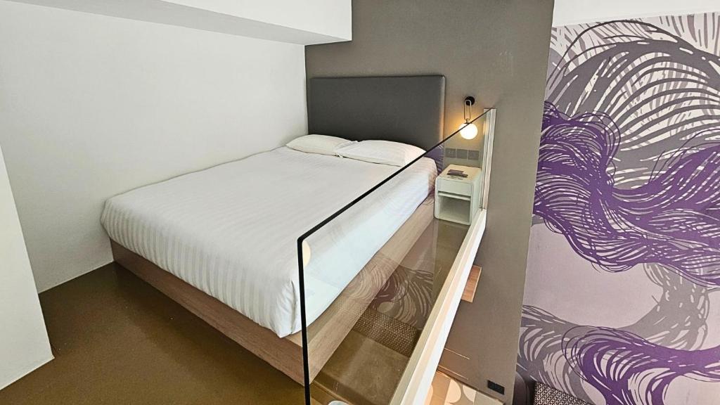 Postel nebo postele na pokoji v ubytování Studio M Hotel