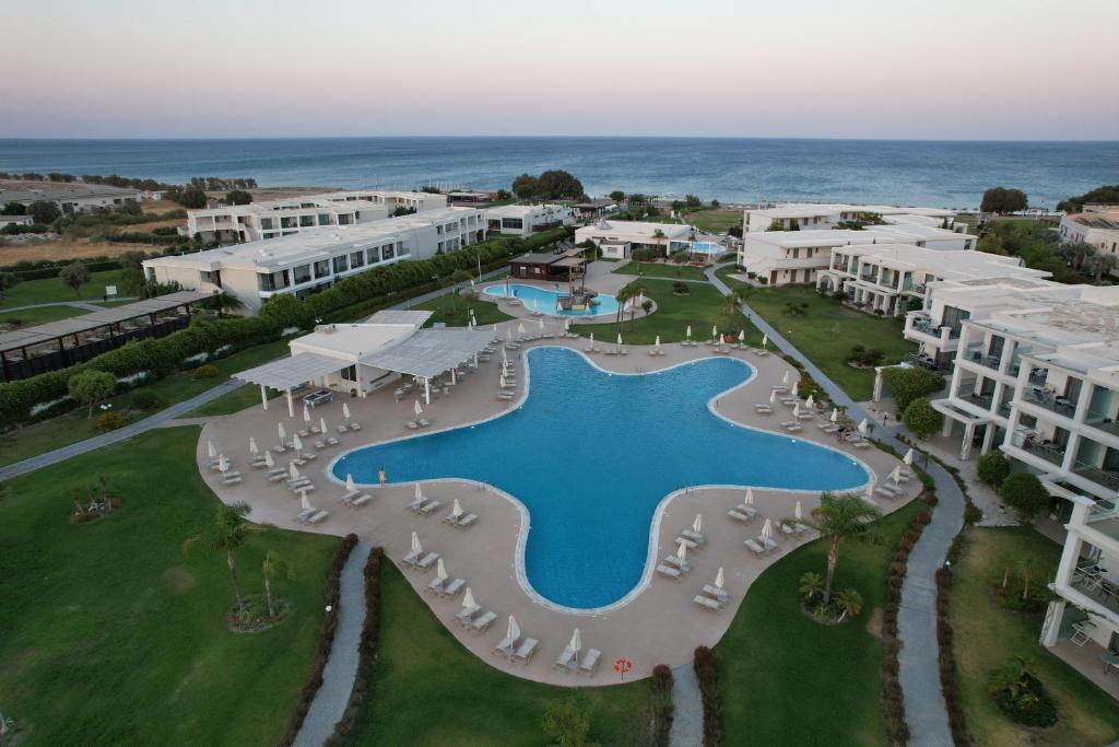 an aerial view of a resort with a swimming pool at Asterias Beach Resort in Afantou