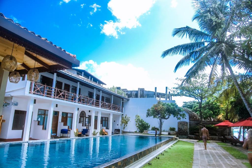 a view of the hotel and the swimming pool at Surf Sea Breeze in Mirissa