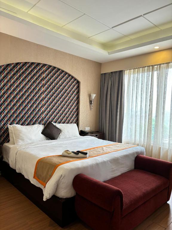Postel nebo postele na pokoji v ubytování Palette 823 Hotel Ichchha