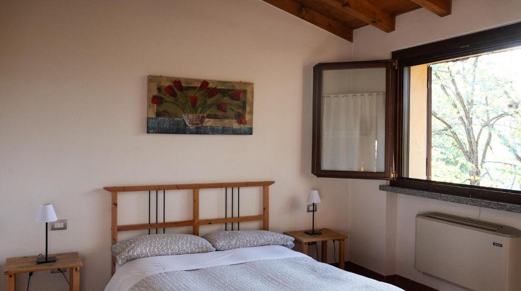 Postel nebo postele na pokoji v ubytování Agri Village Pavia