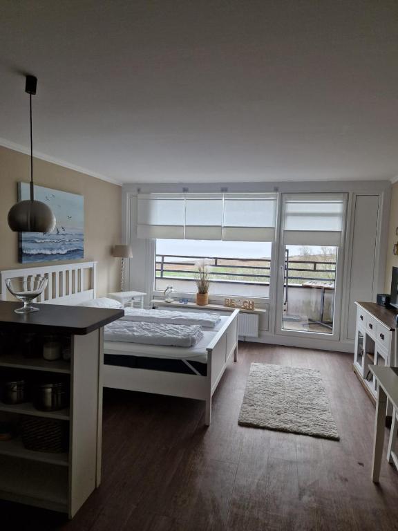 Postel nebo postele na pokoji v ubytování Apartment Fördeblick
