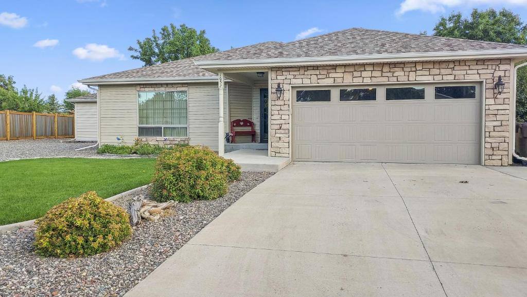 a house with a garage and a driveway at Hermosa Haven home in Montrose