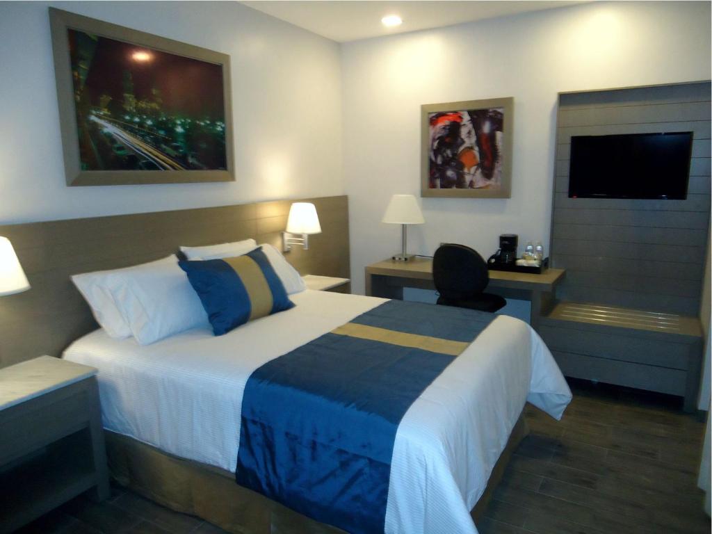Postel nebo postele na pokoji v ubytování Hotel Mansur Business & Leisure