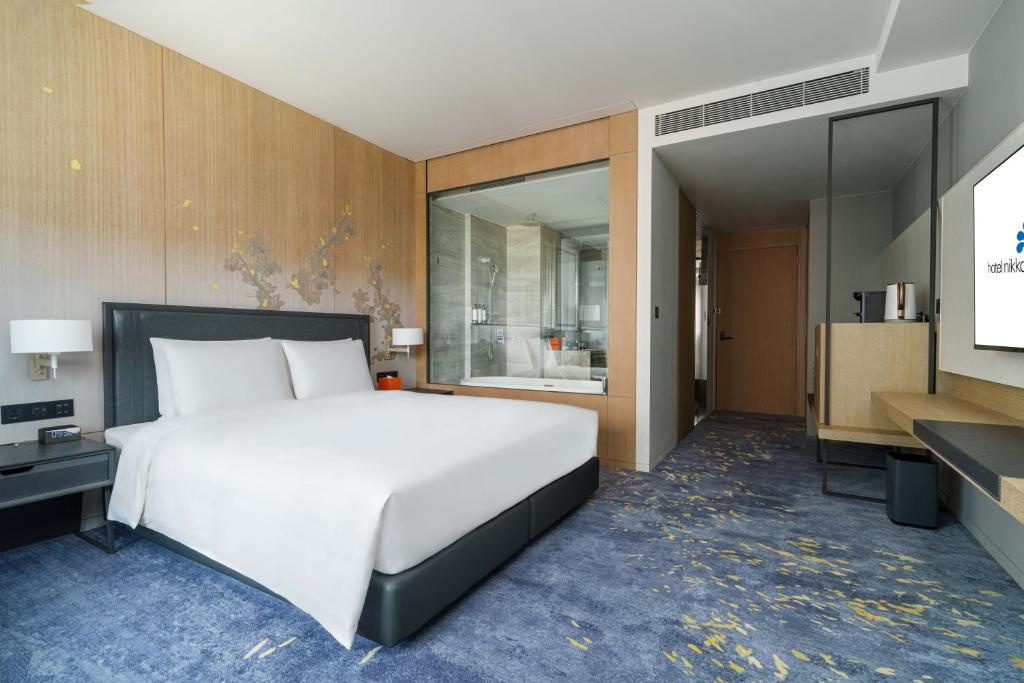 Postel nebo postele na pokoji v ubytování Hotel Nikko Kaohsiung