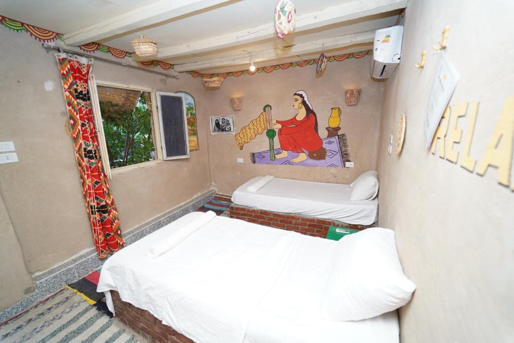 Postel nebo postele na pokoji v ubytování Bedouin Lodge Luxor