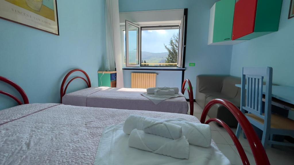 Postel nebo postele na pokoji v ubytování Hostel Villa Lucia