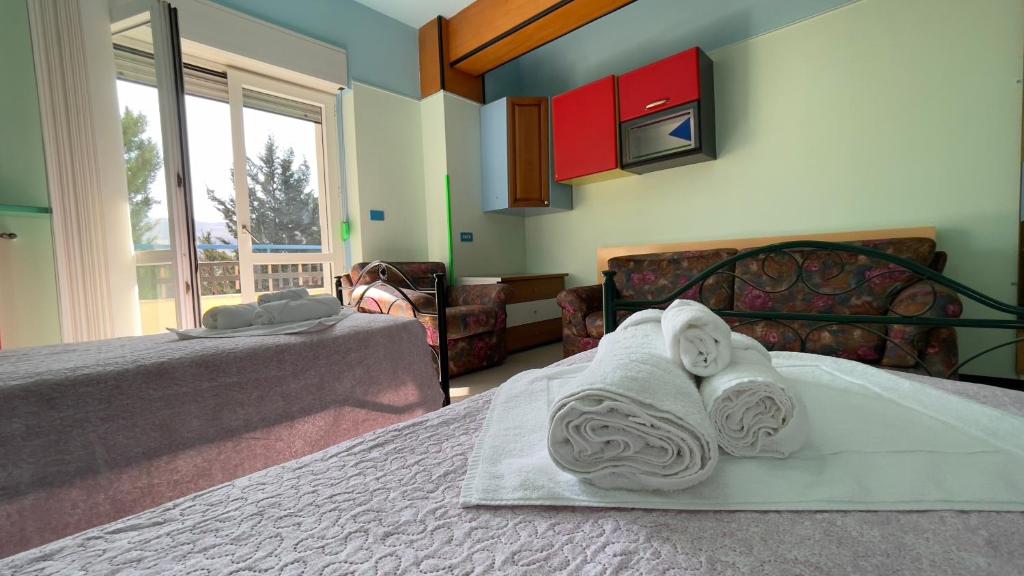 Postel nebo postele na pokoji v ubytování Hostel Villa Lucia
