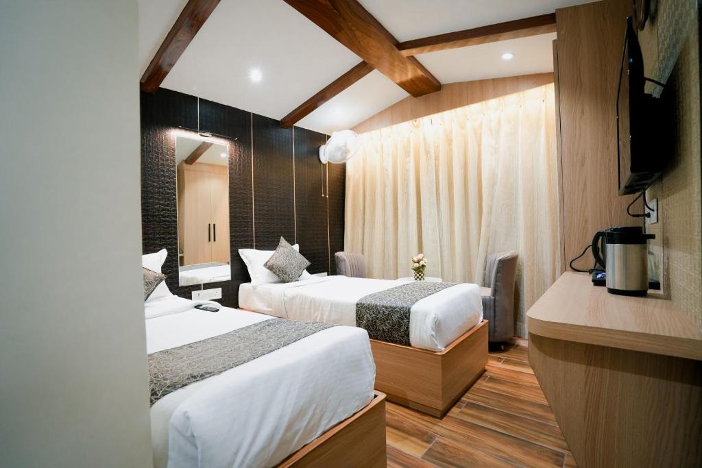 Postel nebo postele na pokoji v ubytování Hotel JK palace