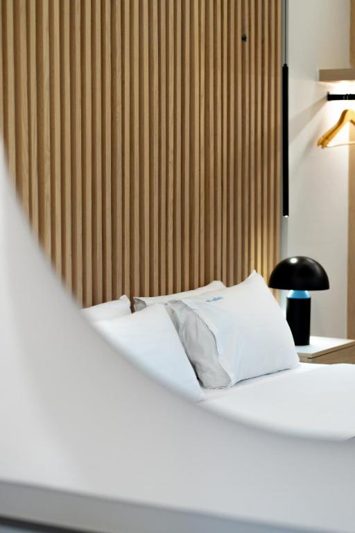 Postel nebo postele na pokoji v ubytování Golden Sun Hotel