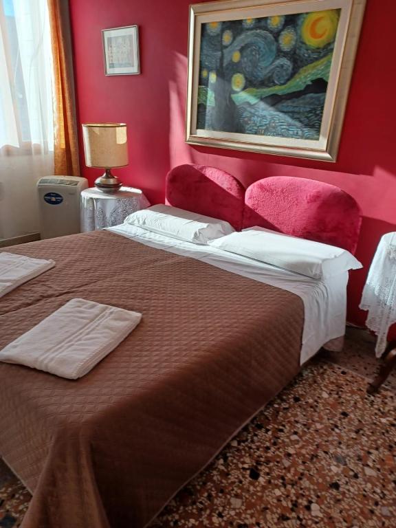 Postel nebo postele na pokoji v ubytování Residence Fortuny