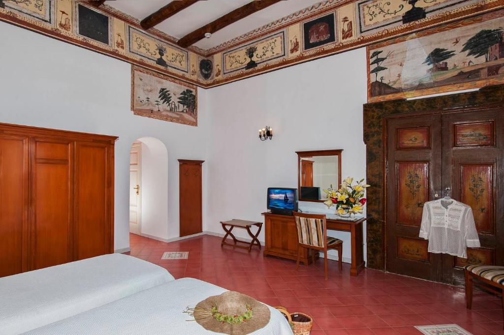 Postel nebo postele na pokoji v ubytování Albergo California