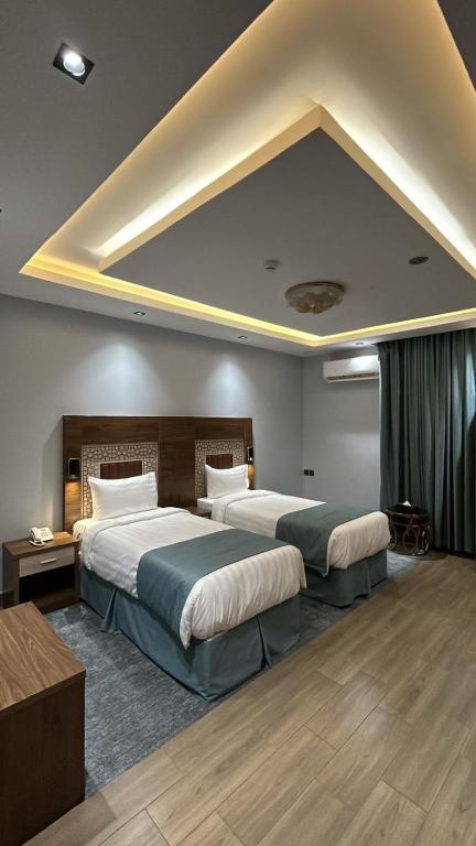 Postel nebo postele na pokoji v ubytování فندق ملاذ Malath Hotel