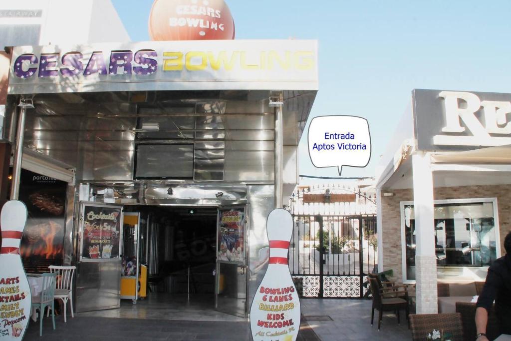 a restaurant with a cone in front of a building at internacional TV un minuto avenida y playa in Tías