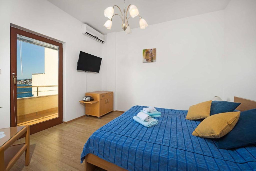 Postel nebo postele na pokoji v ubytování Apartments Kaina