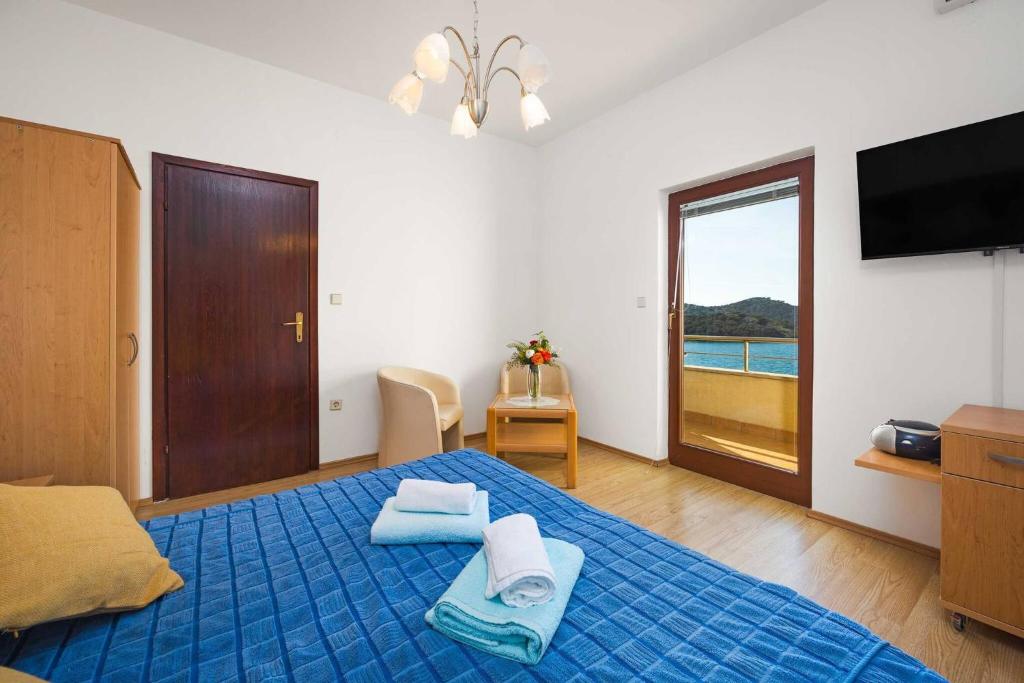 Postel nebo postele na pokoji v ubytování Apartments Kaina