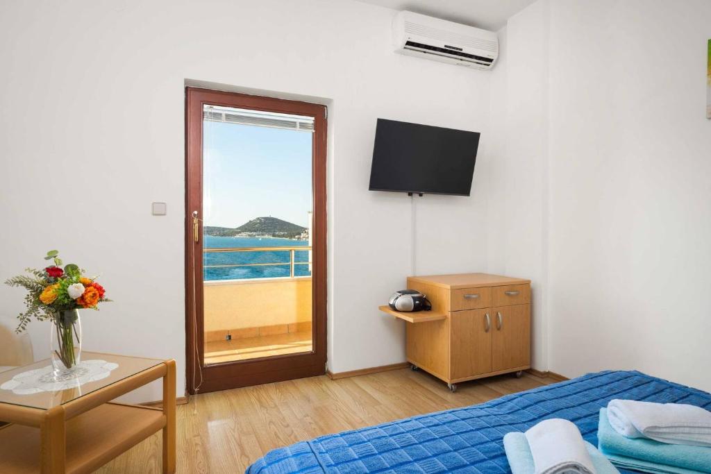 Postel nebo postele na pokoji v ubytování Apartments Kaina