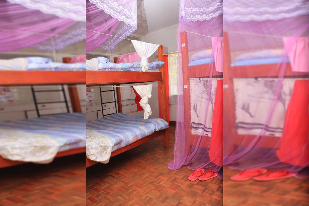 Una cama o camas en una habitación de Jabulani Nairobi Backpackers Hostel
