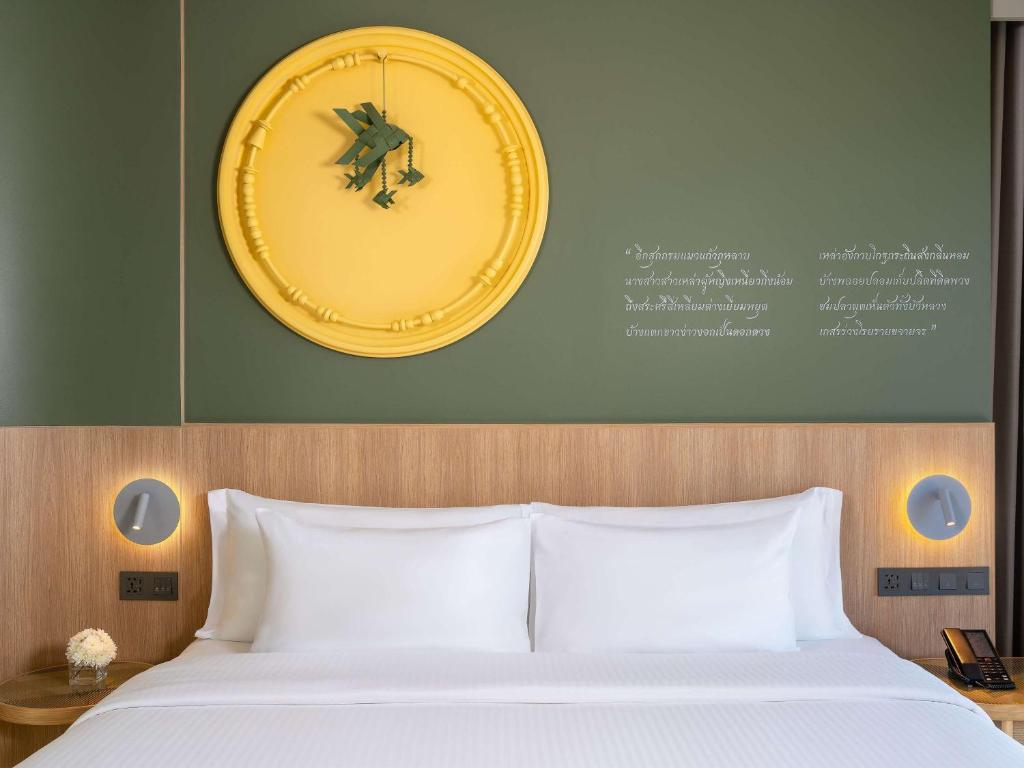 Postel nebo postele na pokoji v ubytování Mercure Rayong Lomtalay Villas & Resort