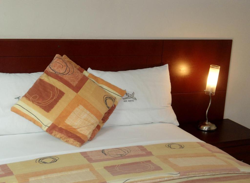 Postel nebo postele na pokoji v ubytování Hotel Air Suites