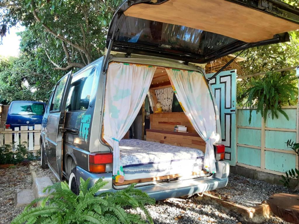 a van with a bed in the back of it at Samatha Camper in Chiang Dao