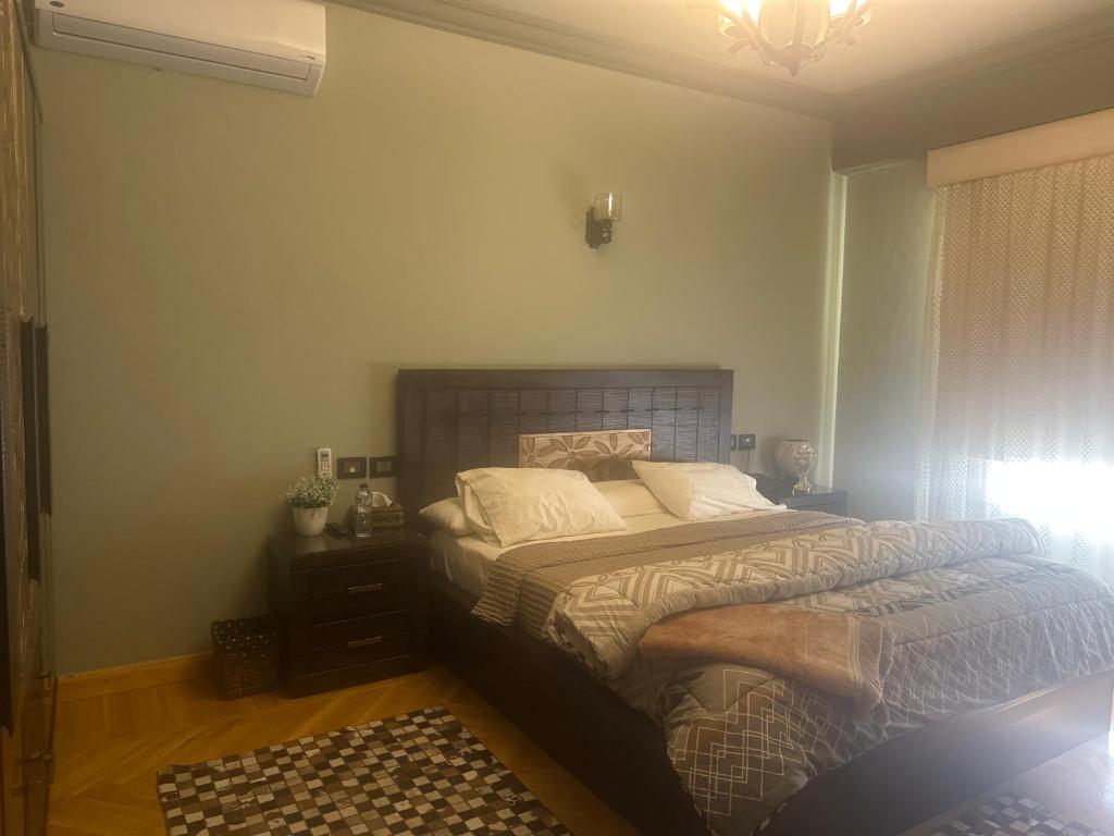 a bedroom with a large bed in a room at room inside villa in Cairo