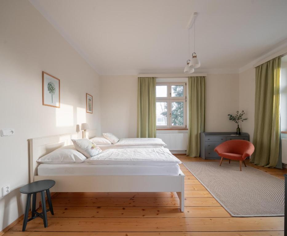 Postel nebo postele na pokoji v ubytování Vila NMNM