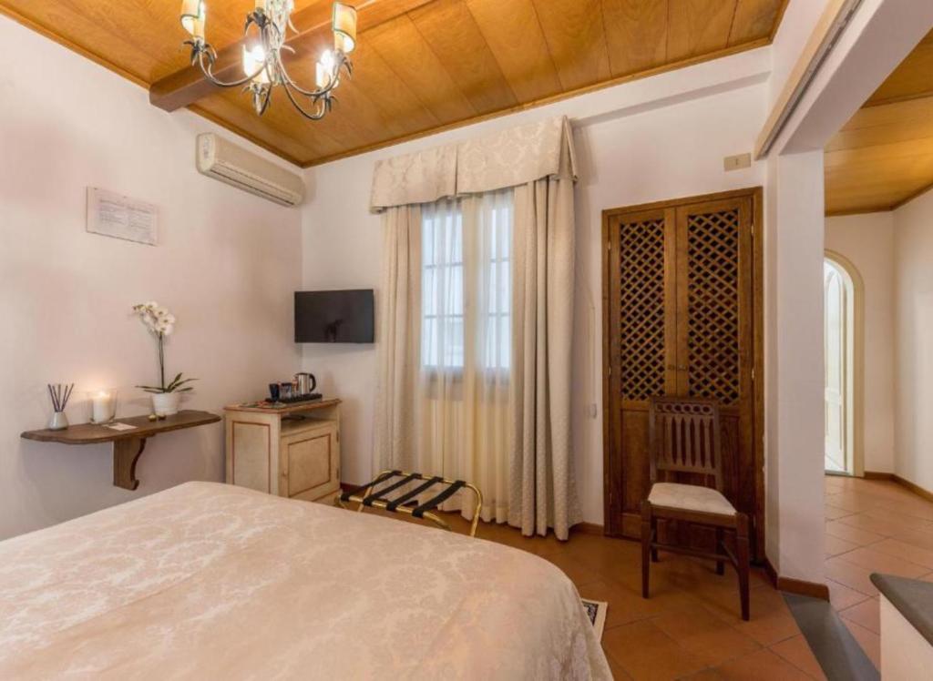 Łóżko lub łóżka w pokoju w obiekcie Numa Florence Palazzo Haggis