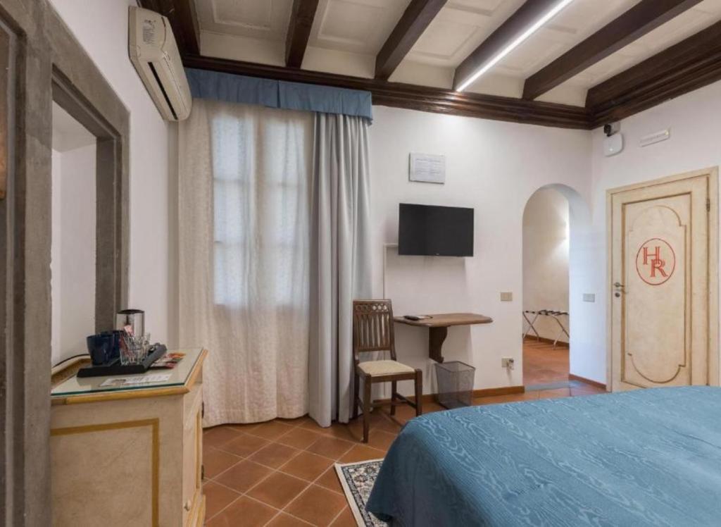 Łóżko lub łóżka w pokoju w obiekcie Numa Florence Palazzo Haggis