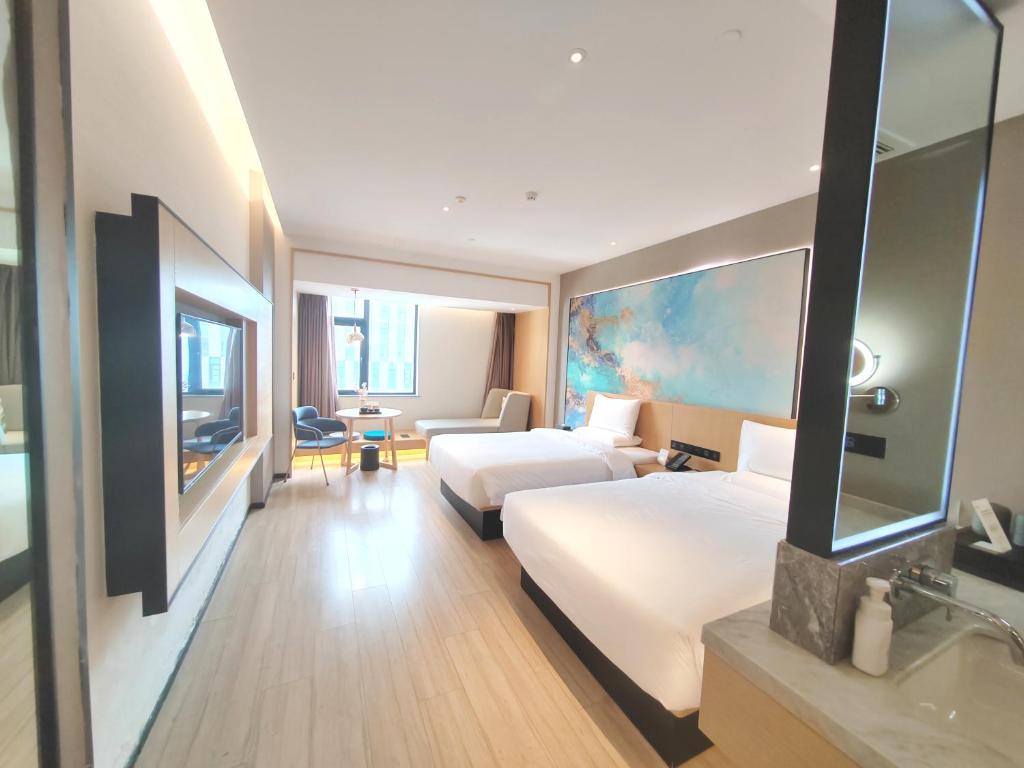 Postel nebo postele na pokoji v ubytování Tuke Hotel Shanghai Hongqiao Center Branch