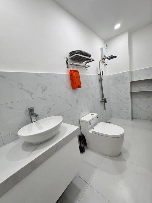 a white bathroom with a sink and a toilet at do not book cancel account LU in San Fernando