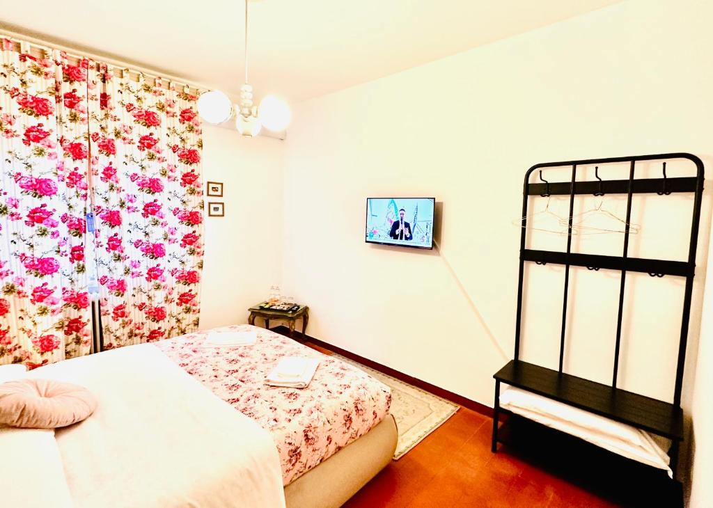 Postel nebo postele na pokoji v ubytování Cisanello Guest House
