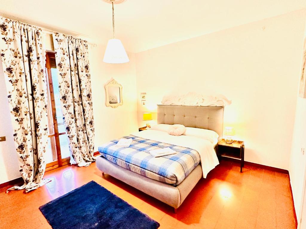 Postel nebo postele na pokoji v ubytování Cisanello Guest House