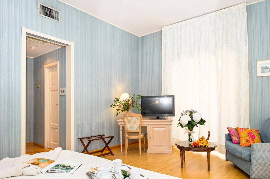 Postel nebo postele na pokoji v ubytování Grande Albergo Quattro Stagioni