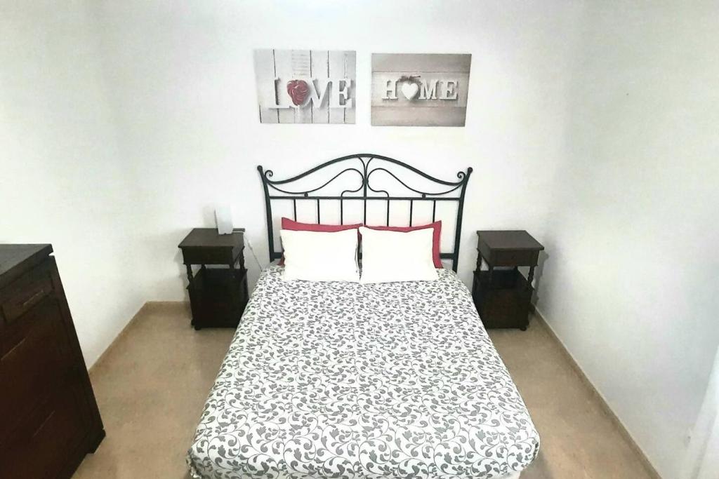 A bed or beds in a room at famara surf wifi 2