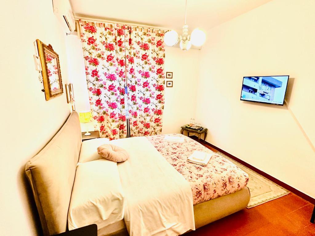 Postel nebo postele na pokoji v ubytování Cisanello Guest House