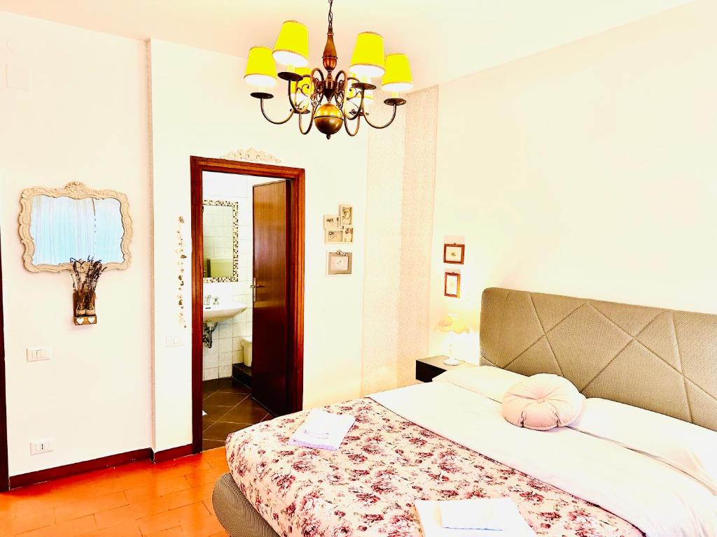 Postel nebo postele na pokoji v ubytování Cisanello Guest House