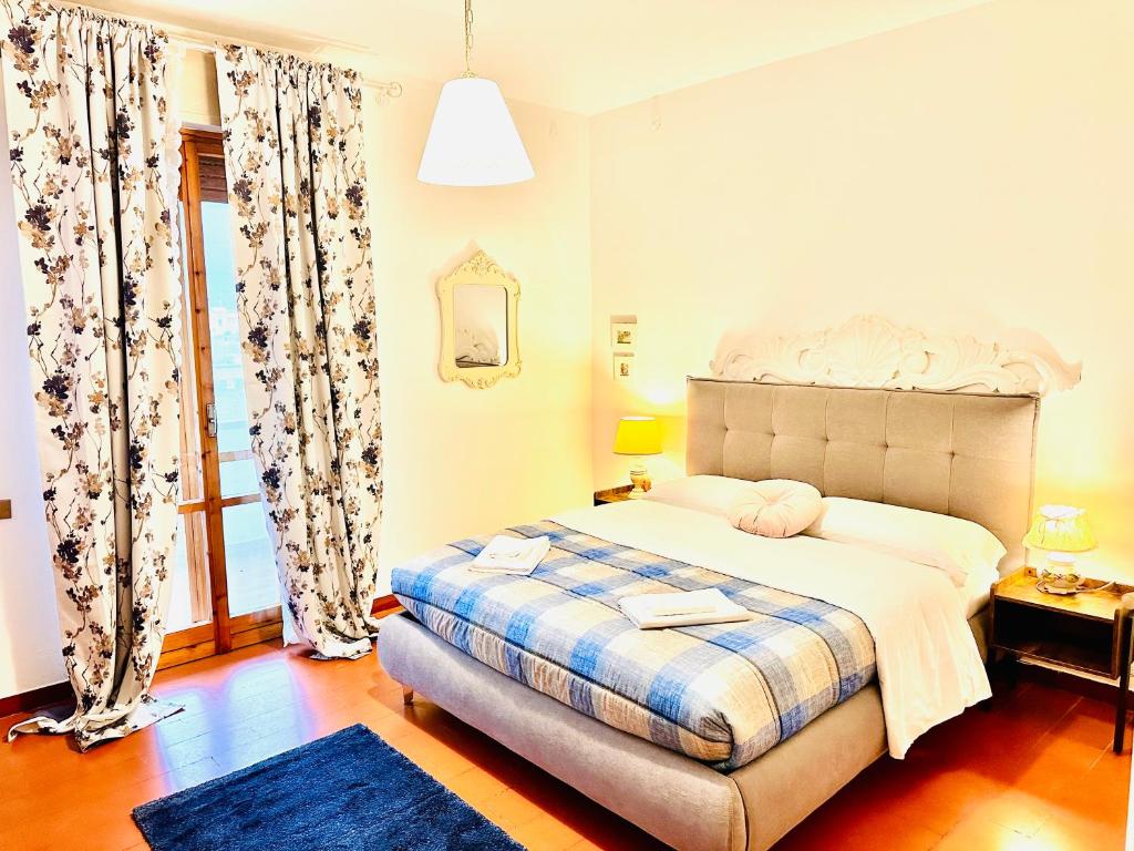 Postel nebo postele na pokoji v ubytování Cisanello Guest House