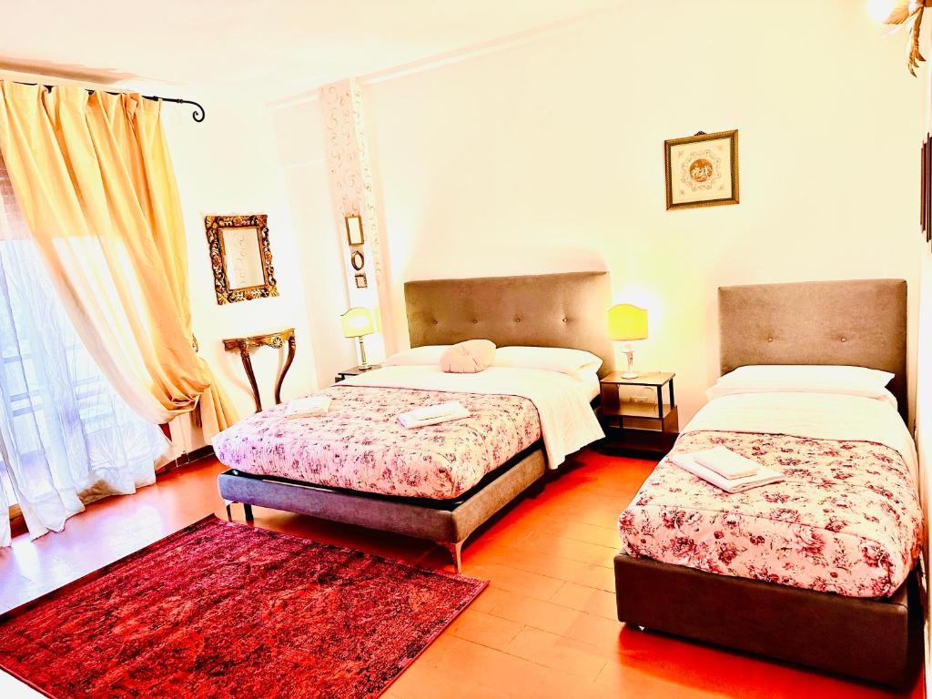 Postel nebo postele na pokoji v ubytování Cisanello Guest House