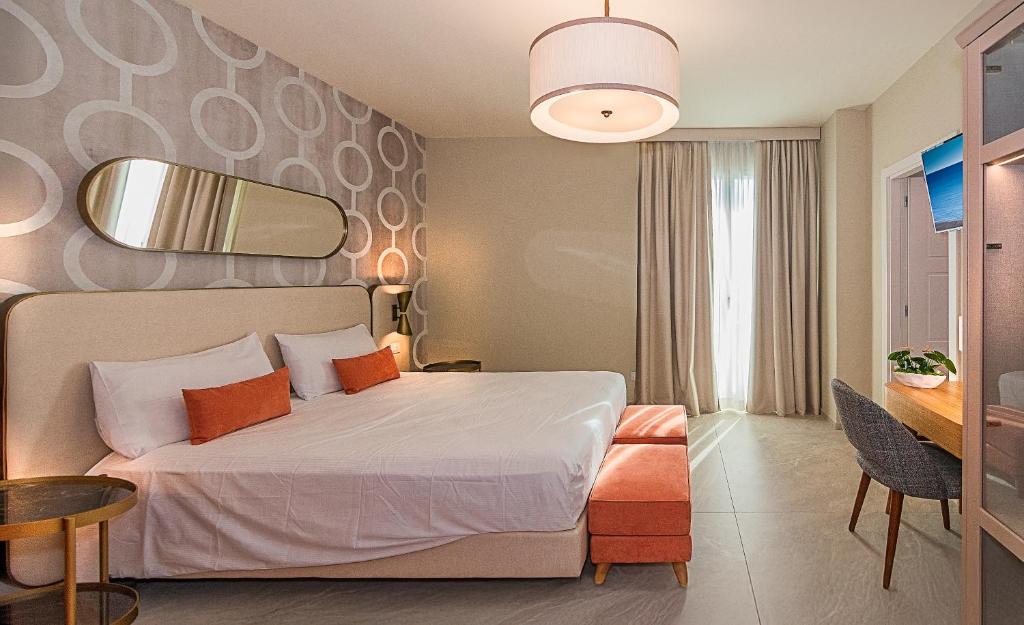 Postel nebo postele na pokoji v ubytování Hotel Mariotti