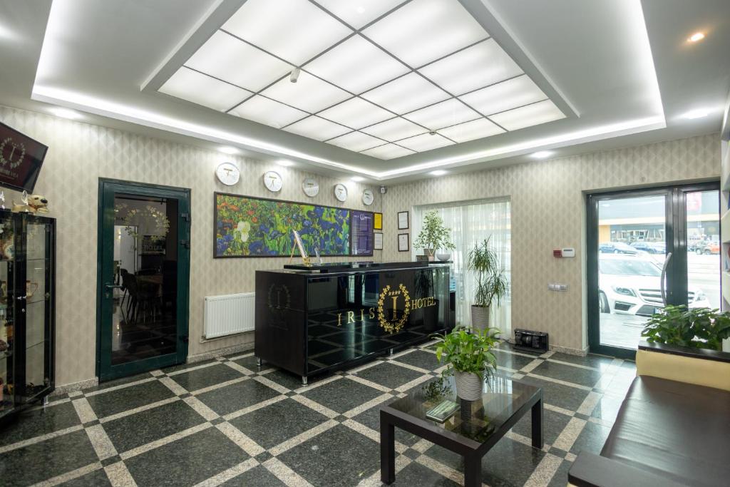 TV a/nebo společenská místnost v ubytování IRIS Hotel