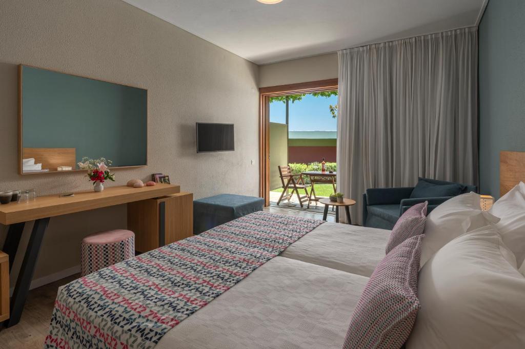Un ou plusieurs lits dans un hébergement de l'établissement Skiathos Palace Hotel